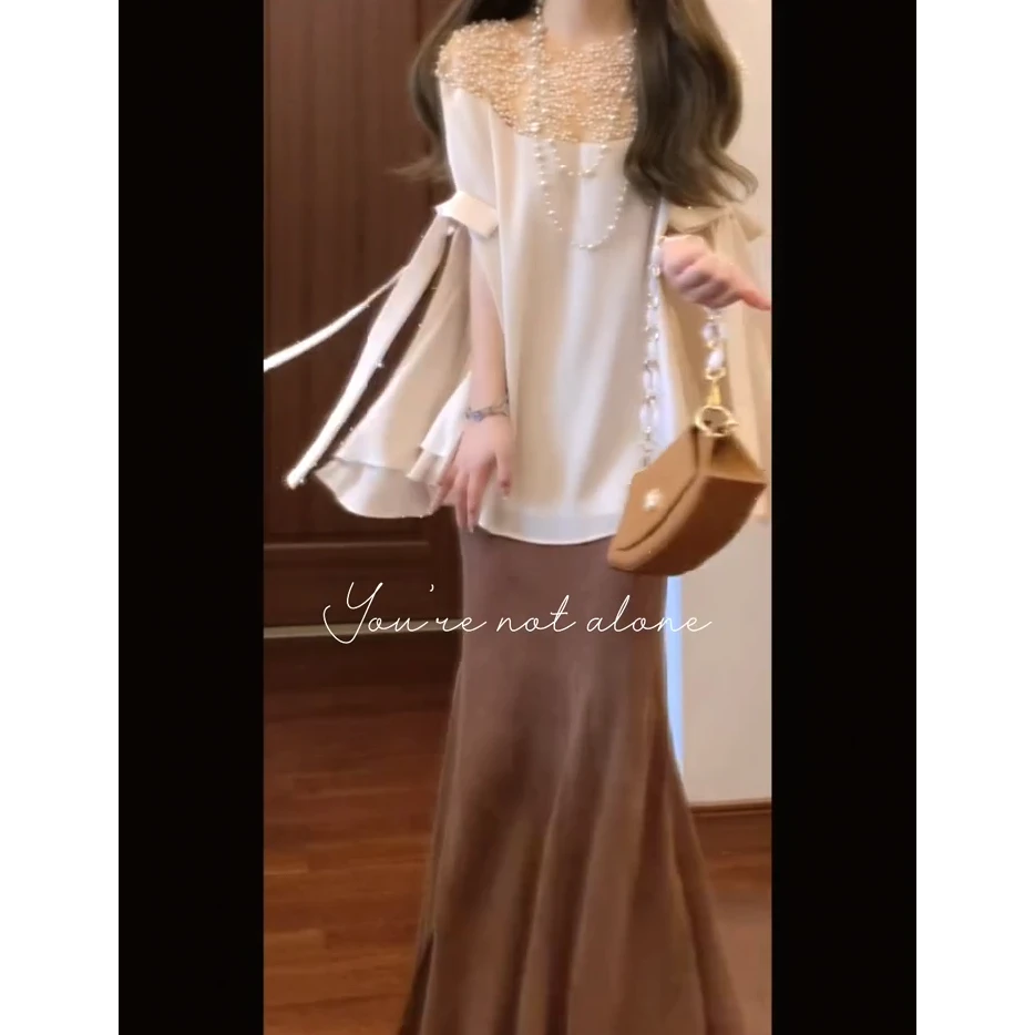 2025夏季新款轻奢小众别致重工珍珠斗篷上衣搭高腰显瘦半身裙套装