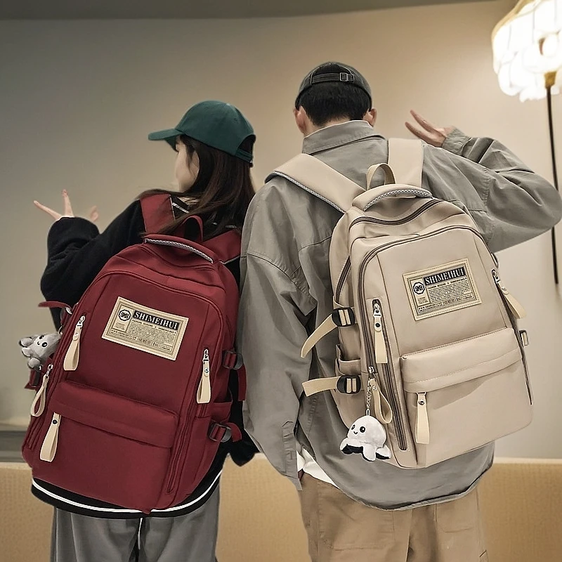 成人书包春夏季简约旅行双肩背包电脑背包标签初高中生大容量书包