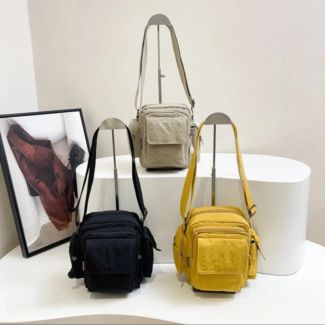 轻便尼龙斜跨包女大容量休闲多口袋手机包运动防泼水单肩包2025