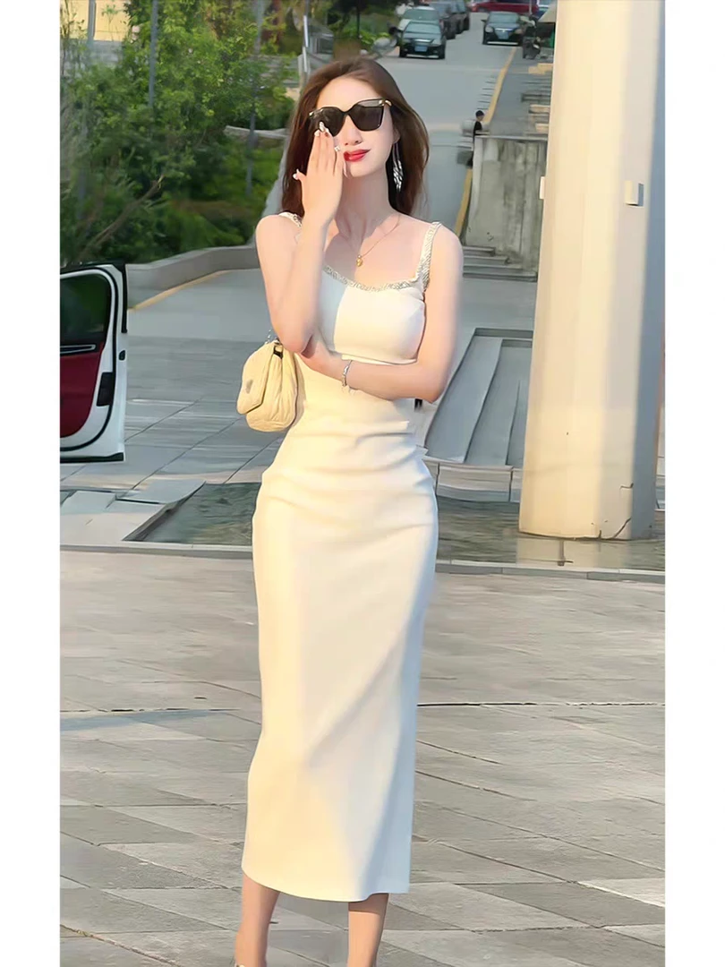 纯欲风吊带连衣裙2025年夏季新款高级感修身无袖白色炸街包臀裙子