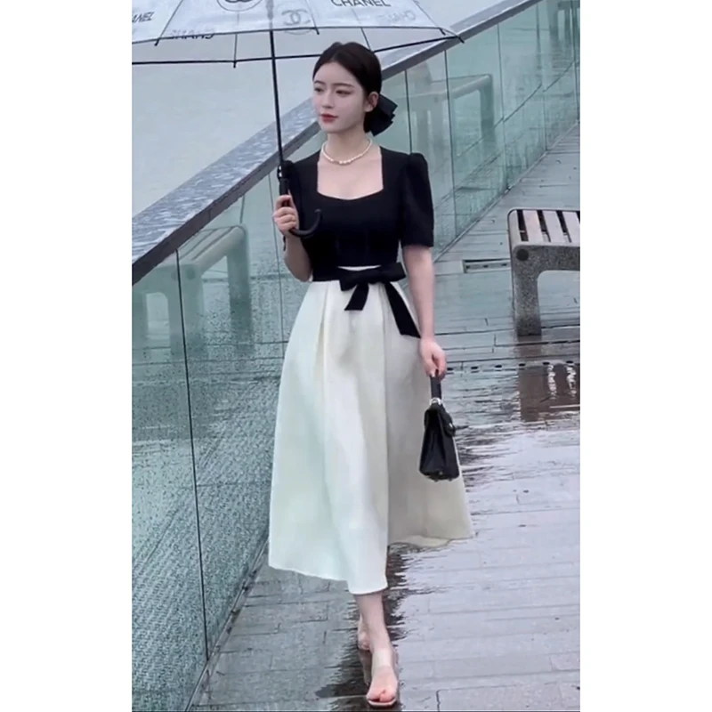 法式赫本风拼接连衣裙女2025夏季新款设计感气质收腰显瘦中长裙子