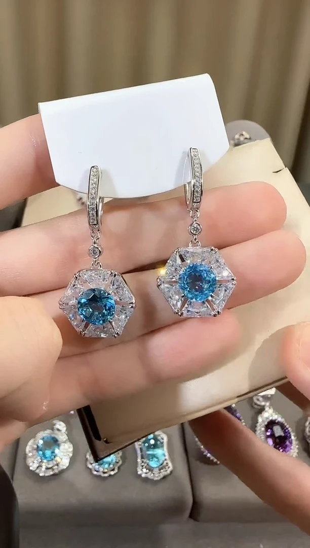 银S925镶嵌托帕石耳饰9mm妖姬蓝耳扣设计款