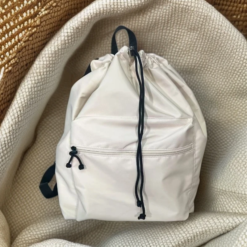 日系抽绳户外双肩包轻量防水大容量旅行户外