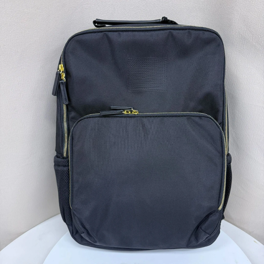 黄色拉链黑色双肩男士背包