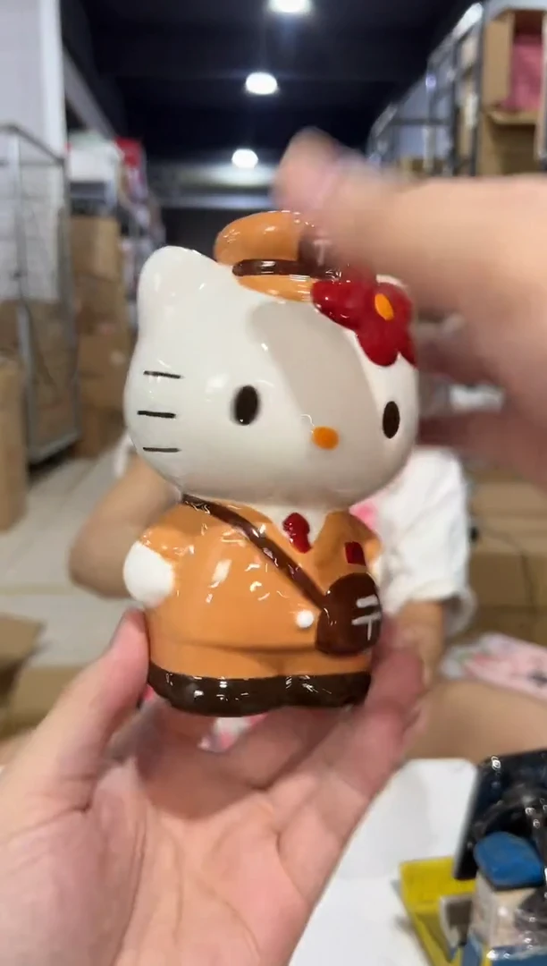 瓷片棕色kt猫邮递员存钱罐