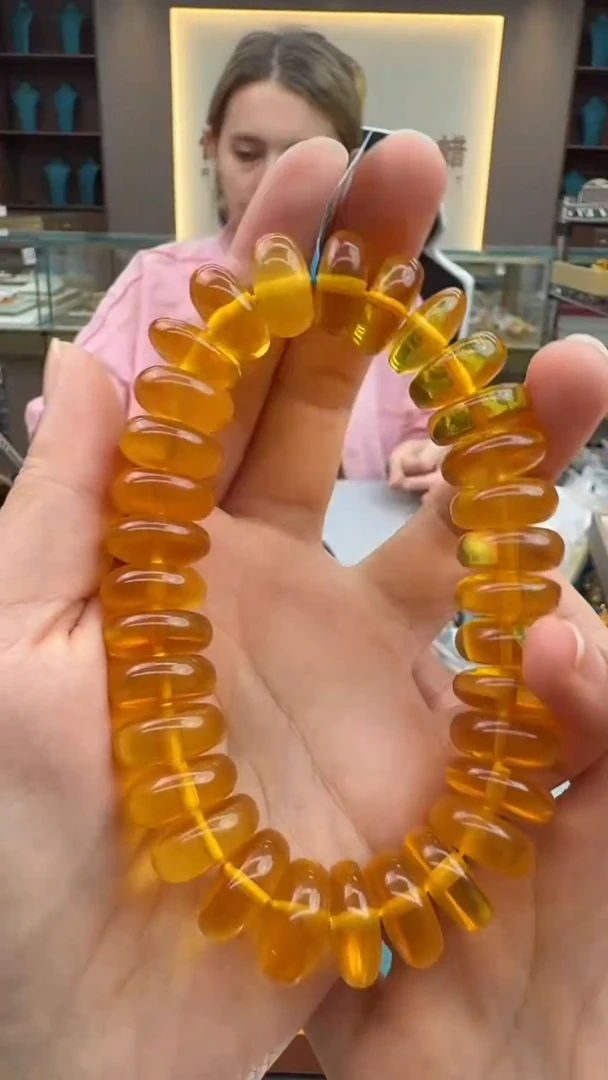手链琥珀未镶嵌32秒拍号 假一罚三