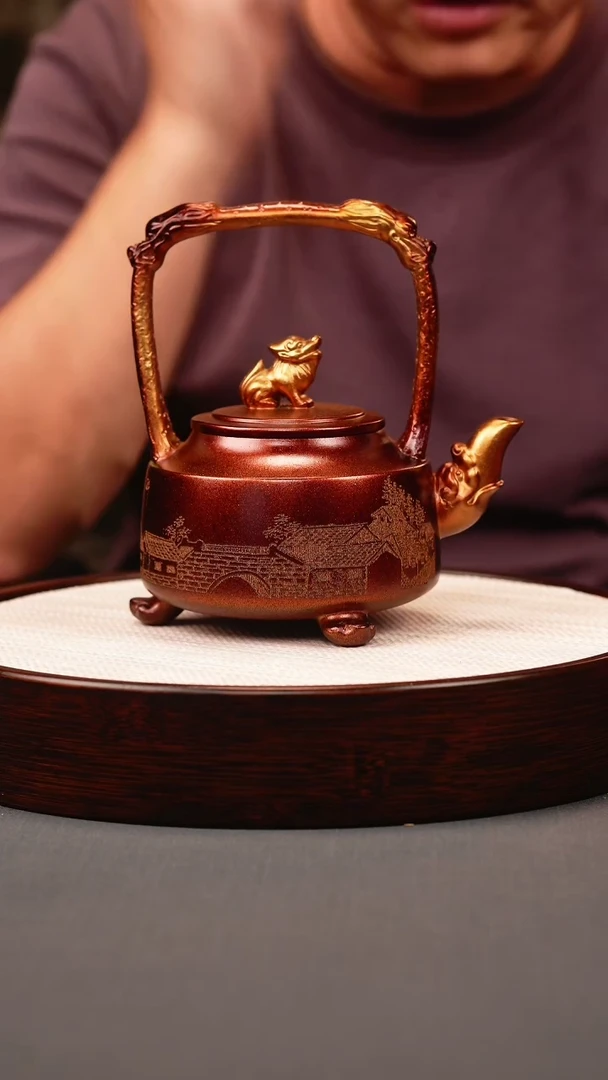 茶壶紫砂贝壳烧 三足提梁 刻绘