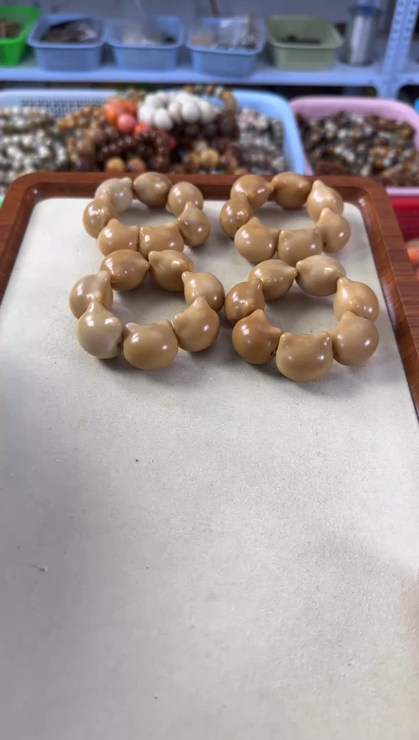 白玉菩提手串25左右象牙果猫猫头手捻微瑕