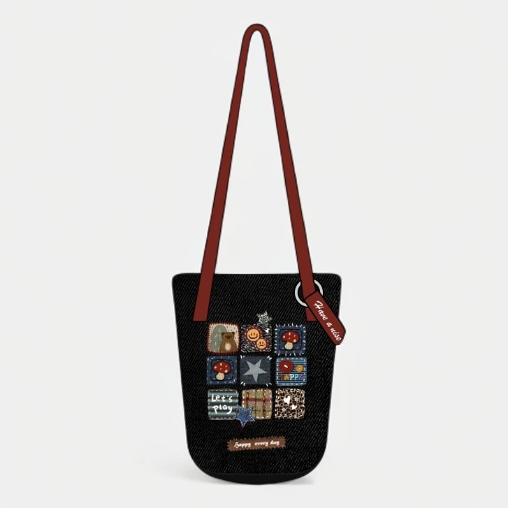 艺术鸭设计师原创黑牛仔拼图系列细肩带水桶包单肩斜挎小众休闲女