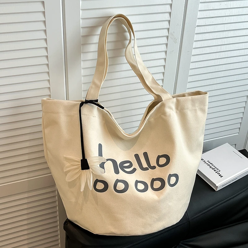 文艺休闲大容量托特包2025春夏新款字母印花单肩包高级感帆布女包