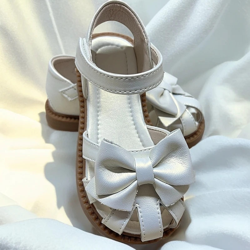 夏季新款女童软底公主鞋镭射白蝴蝶结包头防滑凉皮鞋沙滩女童凉鞋