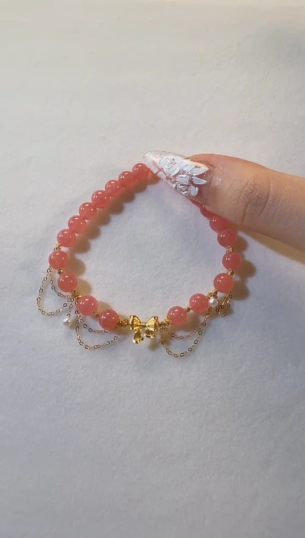 18K金镶嵌菱锰矿（红纹石）手串立体蝴蝶结流苏红纹石