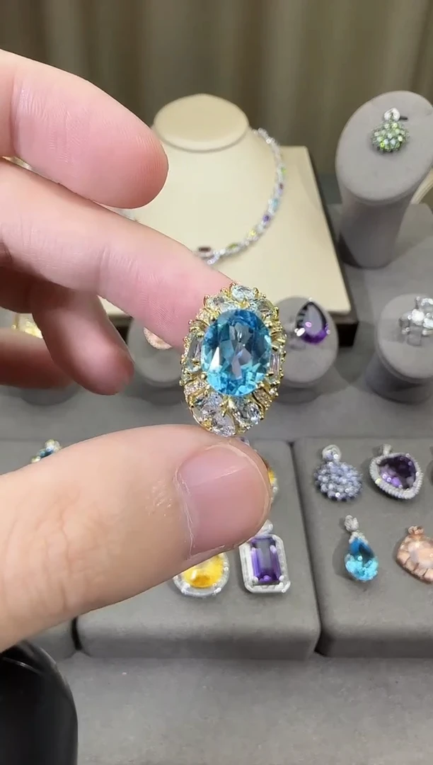 银S925镶嵌戒指托帕石10*8mm妖姬蓝