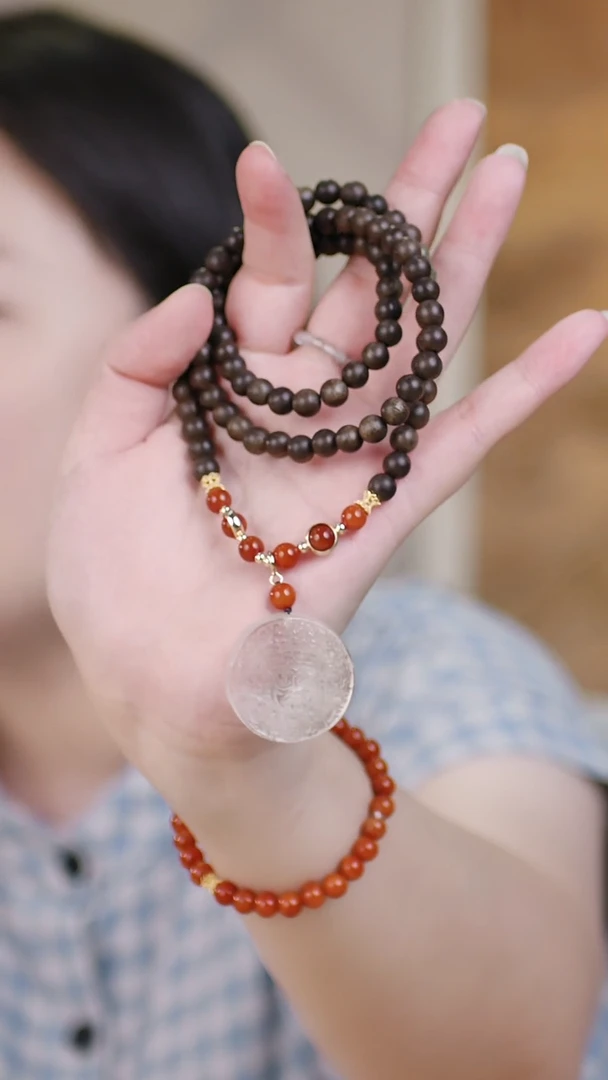 （三圈紫奇楠0.6+白水晶扎基）