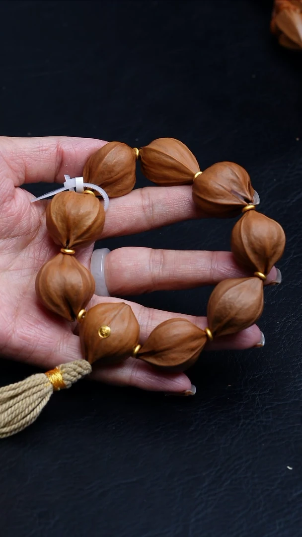 橄榄核吊坠24尺寸4花核素串金标