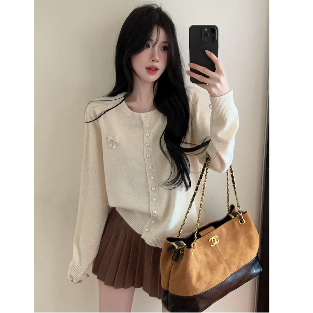 辣妹圆领单排扣针织开衫蝴蝶结纯色百搭毛衣外套上衣配半身裙套装