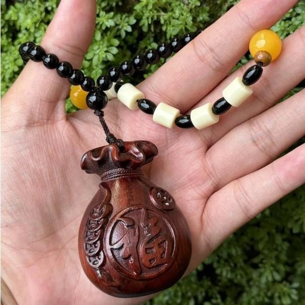 B02紫檀木福袋钱袋挂件手把件