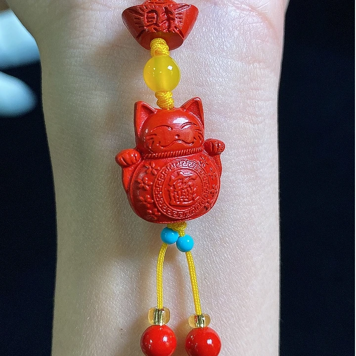 天然辰砂天然辰砂（朱砂）元宝招财猫手机挂/多样性发其一