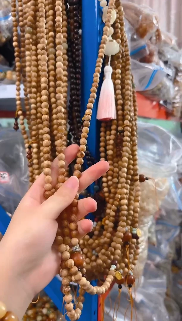 粉压象牙果吊坠斜跨手机链一条