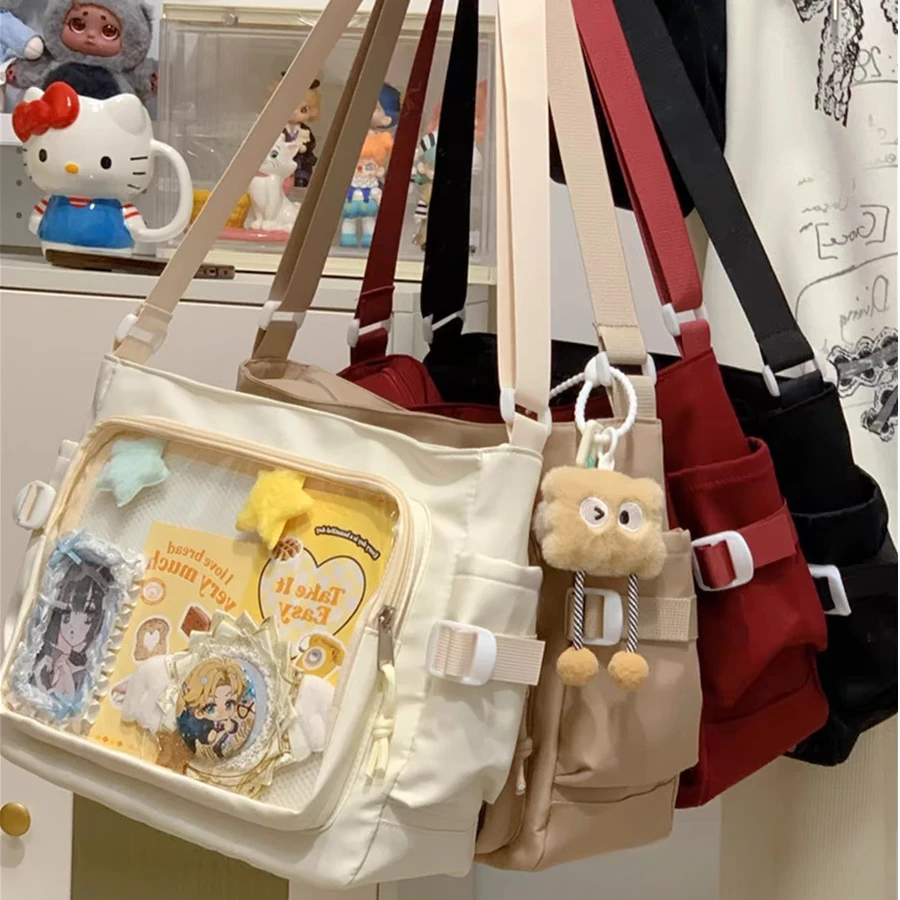 学院风百搭简约大容量邮差包女透明吧唧单肩包斜挎娃包痛包手提JY