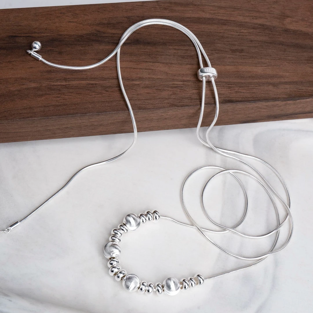 坠链均925银 拉丝猫眼珠蛇骨链抽拉调节时尚毛衣高级项链女