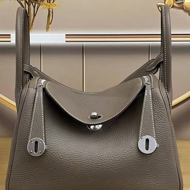 手提包单肩荔枝纹欧美风时髦小姨风机能风摩斯风高处版蜡线琳迪