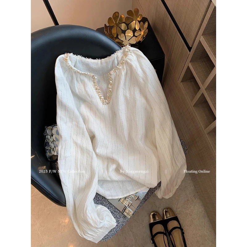 法式v领贝壳装饰条纹长袖衬衫女秋2025新款百搭气质休闲长袖上衣