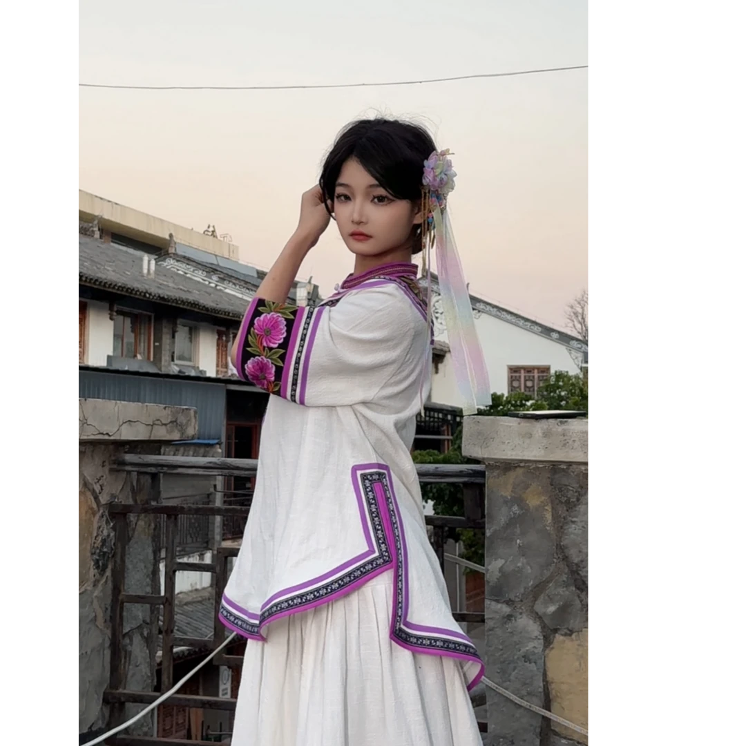 云南四川凉山粉紫色传统服饰旅拍彝族女套装民族服装写真中国风