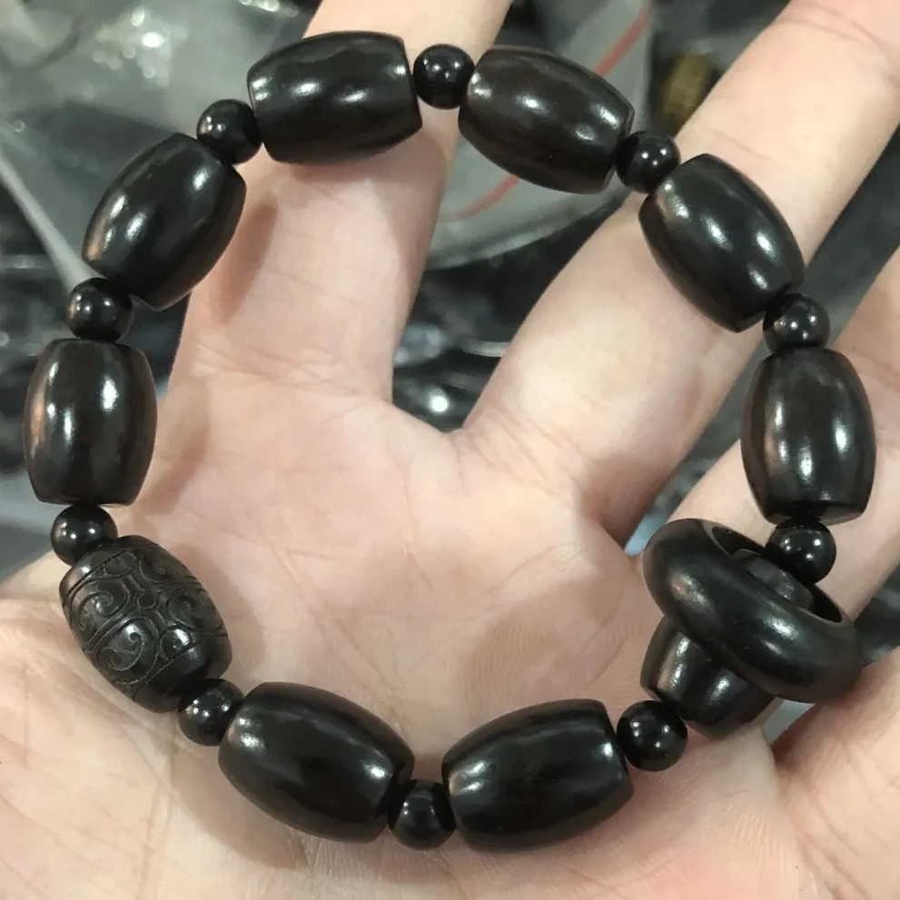 紫光檀桶珠雕刻顶珠带跑环款