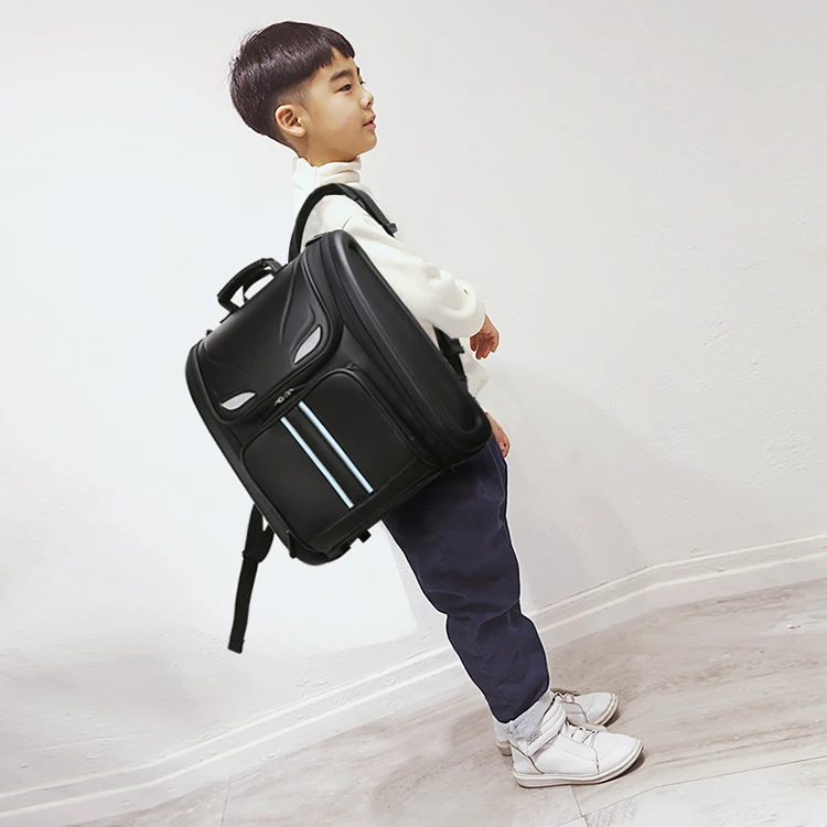 小学生书包超轻耐磨皮质男女生儿童背包减负护脊1-3-6年级