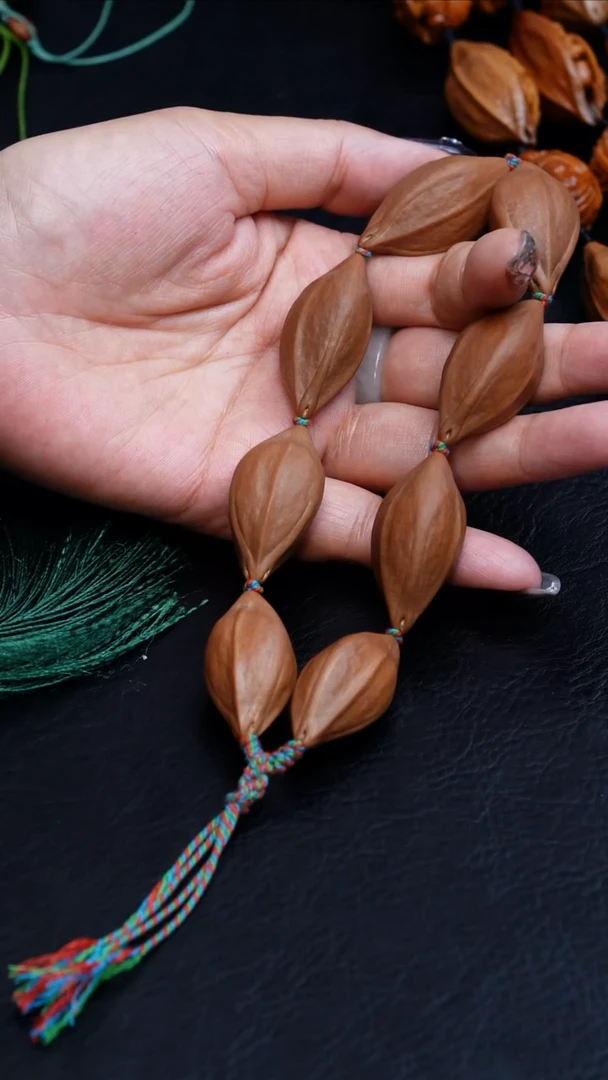 橄榄核吊坠阿*哥18原皮素串