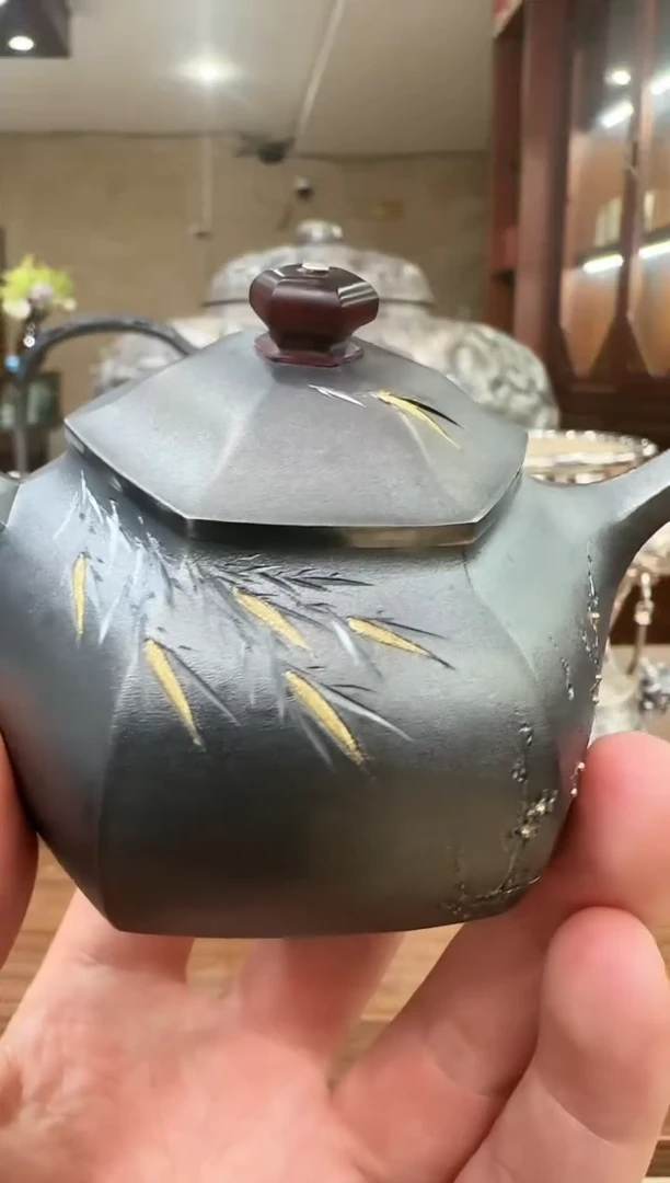 司*?足银999精工手工六方梅兰竹菊泡茶壶
