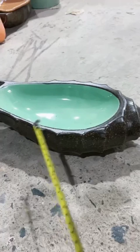 293瑕疵咖色海螺盘一个