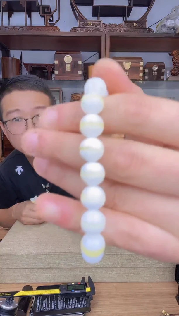 乌木类书架407塑料金丝1.0单圈手串   有气孔瑕疵