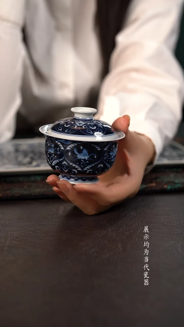 洪印慕明蓝地凤鸟瑞兽布袋盖碗