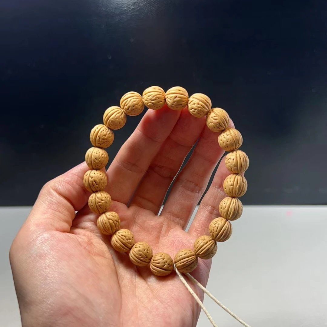 1.0（盘锦小奶豆）桃核手串