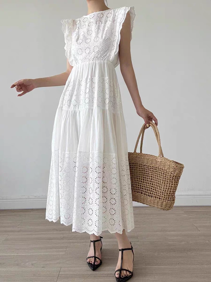 重工刺绣白色天丝连衣裙女2025夏新款高级感蕾丝镂空中长款仙女裙