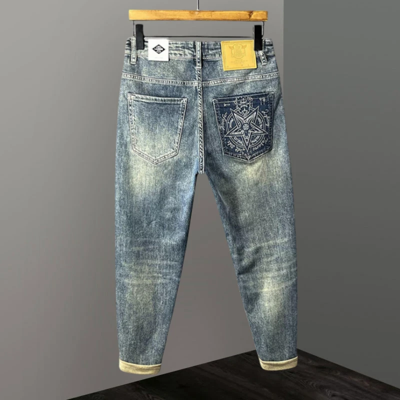 Jeep吉普牛仔裤潮流男士刮烂小脚裤休闲时尚提花四季破洞复古长裤