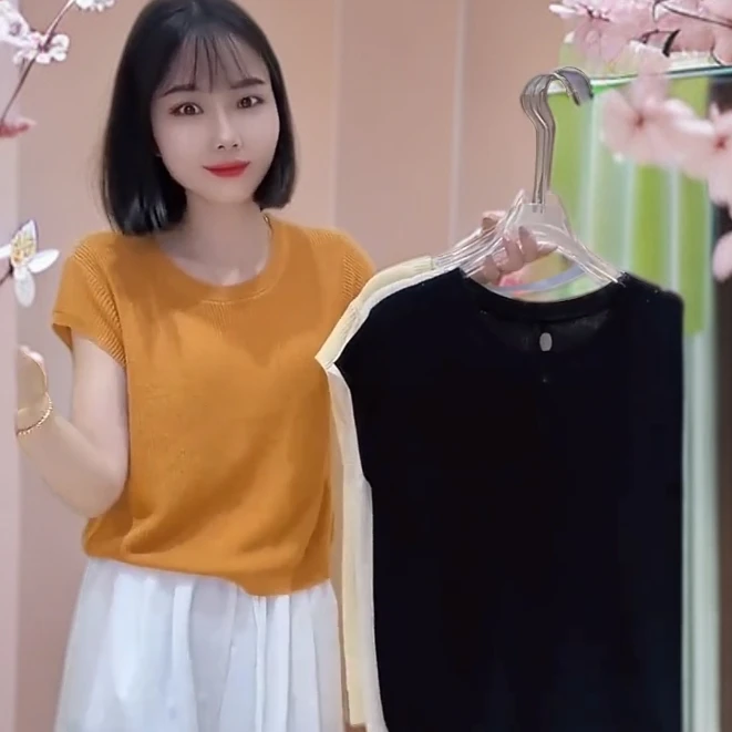 橘色圆领针织后背镂空纽扣短袖女2025夏季新款小众设计毛衣女秋冬