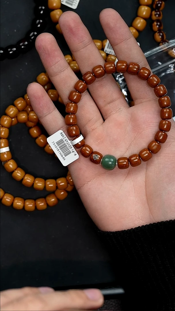 手串紫金鼠0649实心咖红皮道珠带小玉 带金标