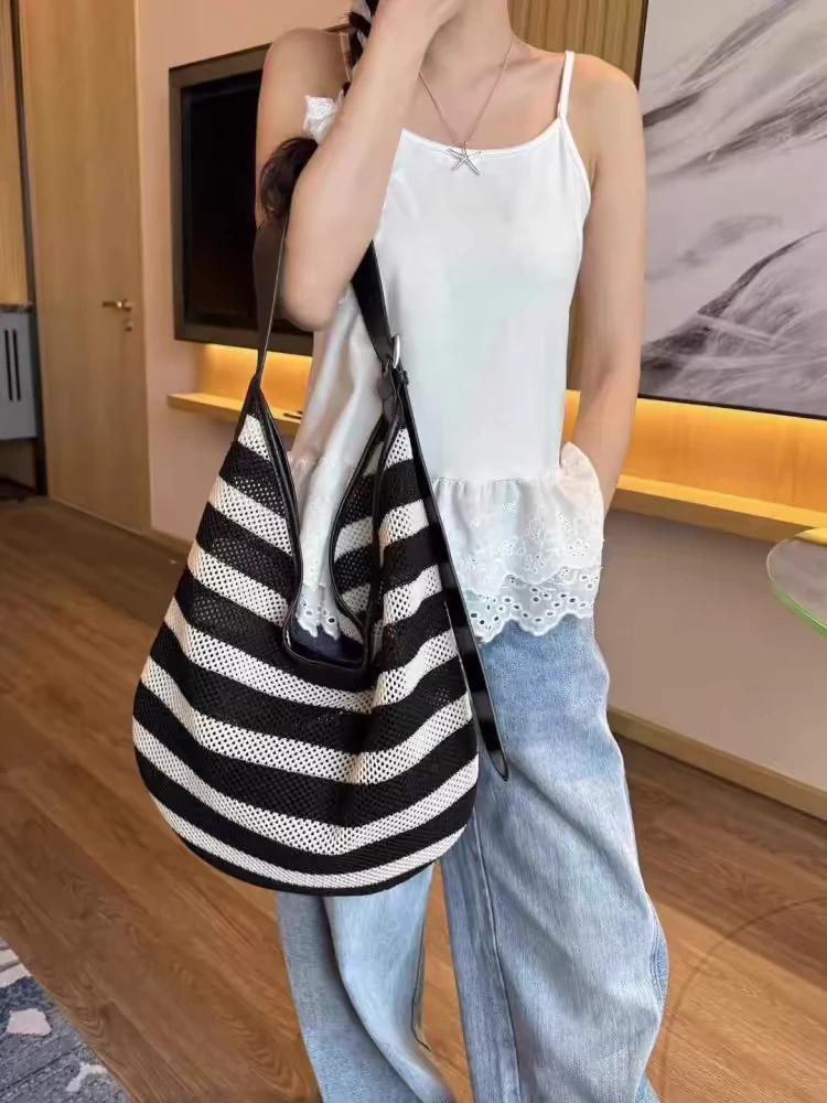 慵懒风撞色休闲编织包包女2025夏天新款时尚通勤包镂空单肩斜挎包