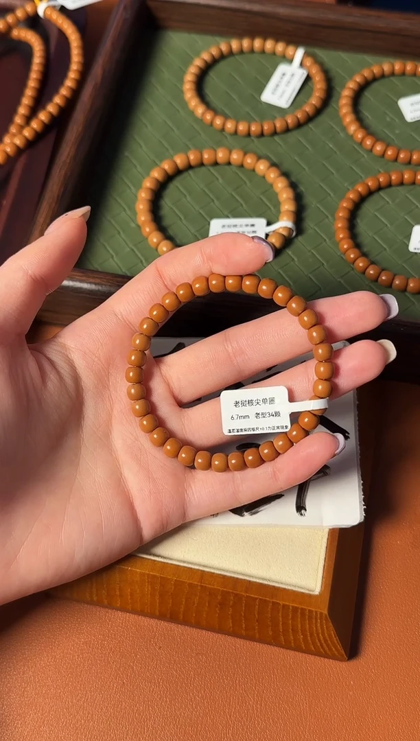 手串橄榄核【168核尖】6.7mm老挝核尖老型单圈 三花面无白树王老料