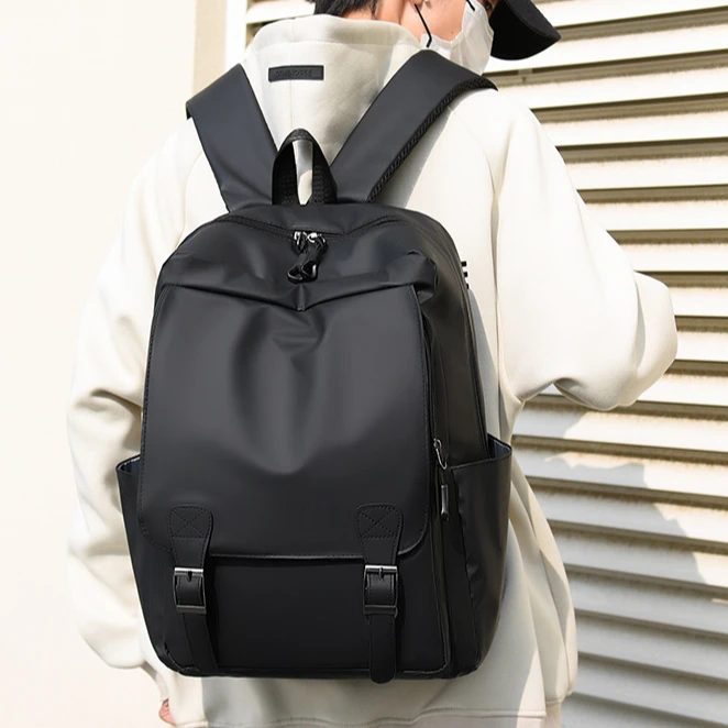 潮流双肩包大学生商务休闲笔记本电脑包欧美英伦风时尚翻盖双肩包