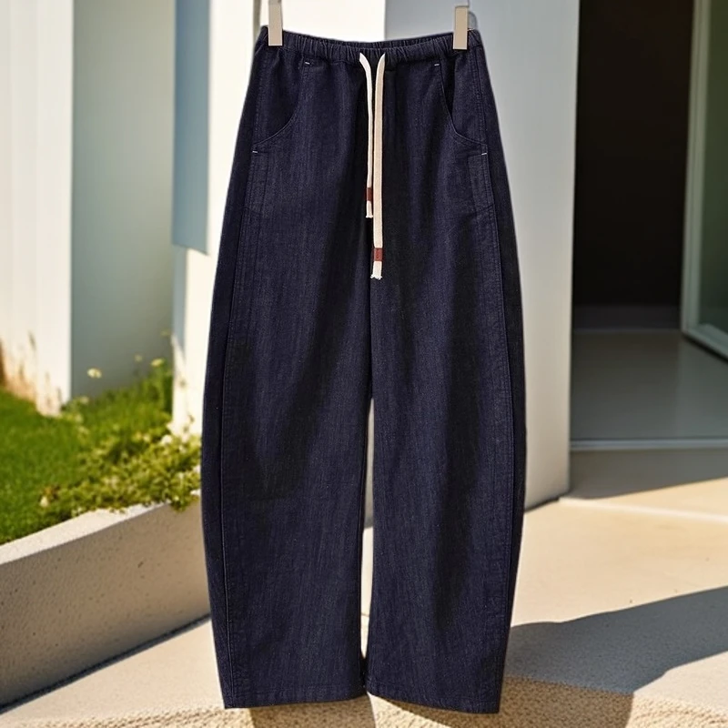 今年流行抽绳弯刀阔腿牛仔裤女2025春季新款大码宽松显瘦香蕉裤子