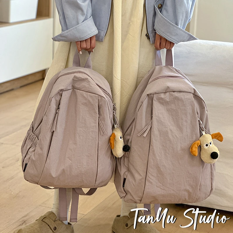 探屿旅游轻便高级感小众双肩包大学生通勤初中生女生书包简约背包