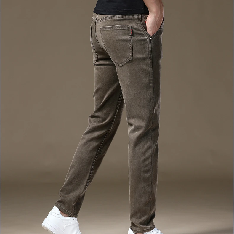 2025秋冬新款香槟黄修身牛仔裤潮流百搭时尚弹力小脚直筒休闲裤男