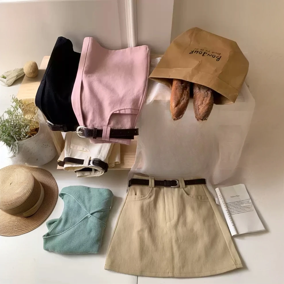 韩系少女粉米白色牛仔棉配皮带短裙女春夏高腰包臀A字显瘦半身裙