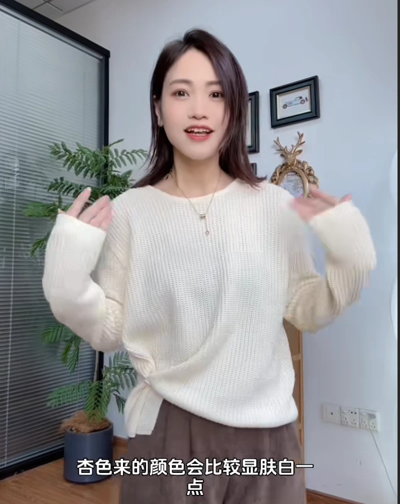 2025年韩系设计感下摆提扣针织衫女秋季新款百搭简约休闲纯色毛衣
