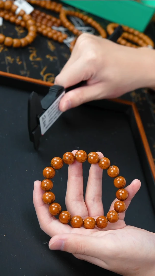 手串紫金鼠油核光珠12+      10692