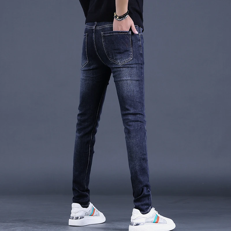 九牧欧货春秋新款高端蓝黑色牛仔裤男士修身小脚时尚弹力休闲长裤